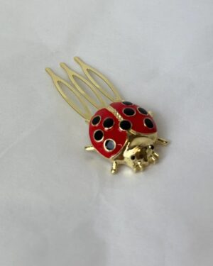 Peinecillo mariquita roja
